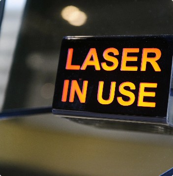 Laser in use sign outside of door inside tri parramatta